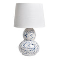**Lampe design en céramique blanche à motifs bleus**